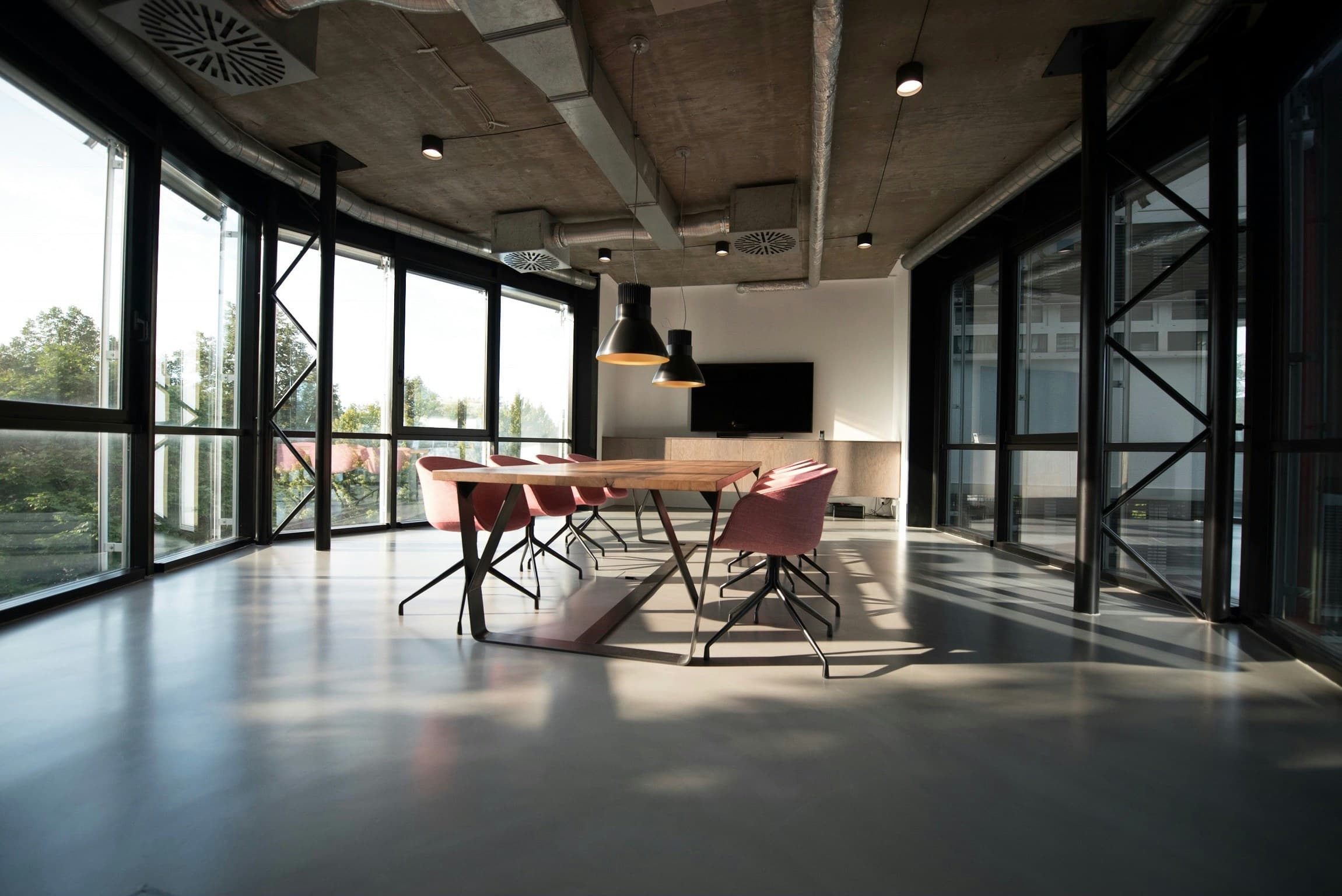 A polished workspace overlooking a city skyline — clear pricing for teams turning planning data into pipeline.